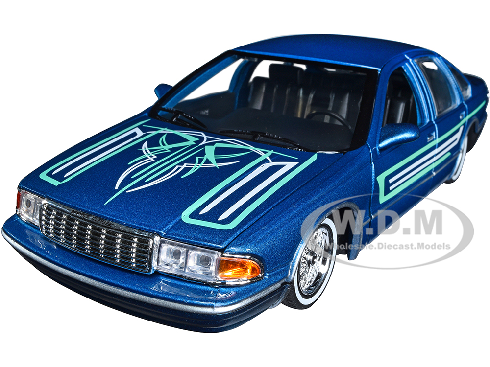 1993 Chevrolet Caprice Lowrider Blue Metallic with Graphics "Get Low" Series 1/24 Diecast Model Car by Motormax