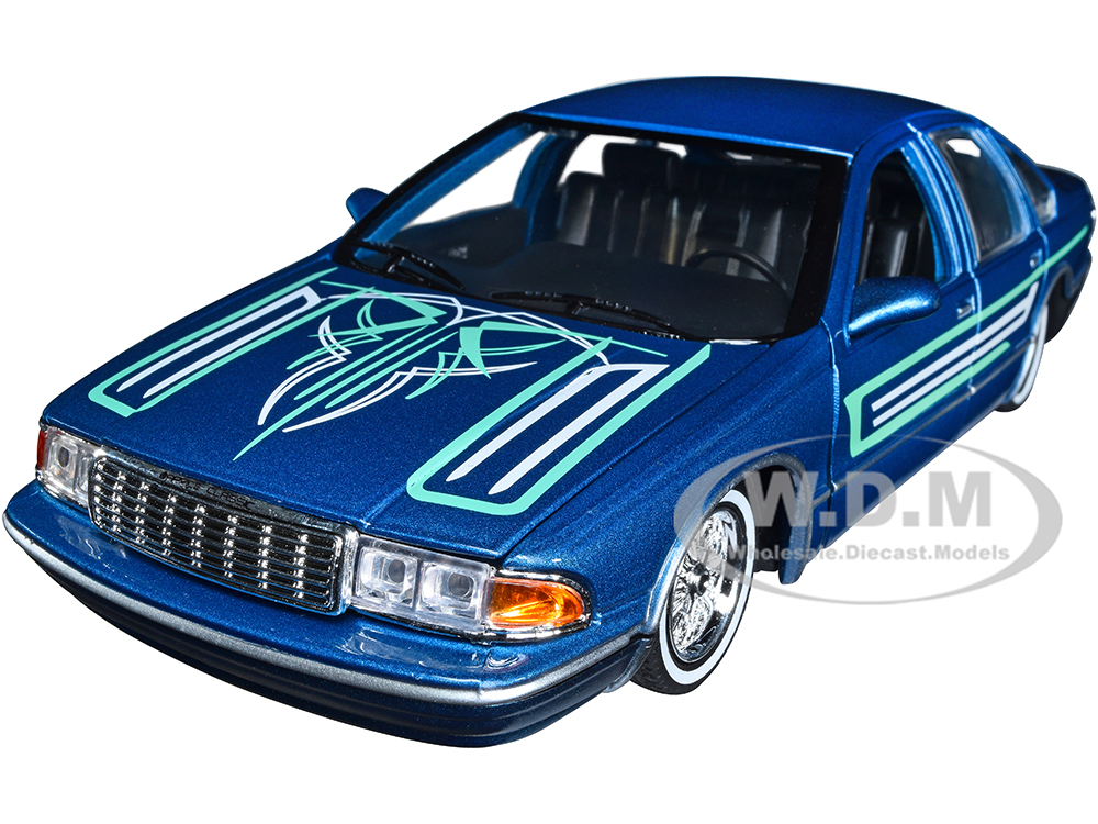 1993 Chevrolet Caprice Lowrider Blue Metallic with Graphics Get Low Series 1/24 Diecast Model Car by Motormax