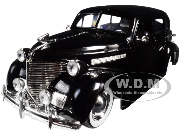 Image of 1939 Chevrolet Master Deluxe Black with baby Moon Wheels "Showroom Floor" 1/24 Diecast Model Car by Jada