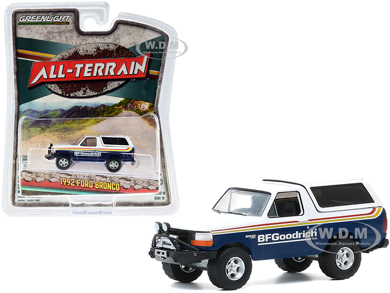 Image of 1992 Ford Bronco with OffRoad Parts "BFGoodrich Tires" Blue and White with Stripes "All Terrain" Series 10 1/64 Diecast Model Car by Greenlight