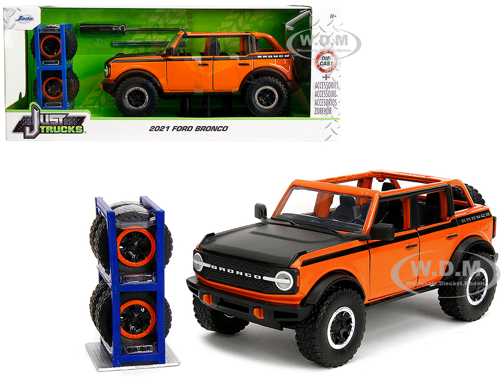 2021 Ford Bronco Open-Top Orange with Black Stripes and Hood with Extra Wheels Just Trucks Series 1/24 Diecast Model Car by Jada