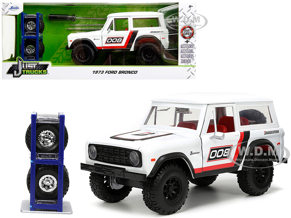 1973 Ford Bronco #008 White with Red and Black Stripes and Red Interior with Extra Wheels Just Trucks Series 1/24 Diecast Model Car by Jada