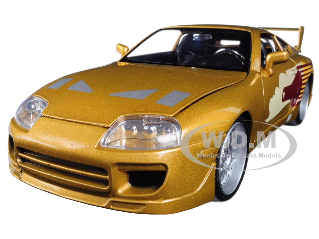 Brand new 1:24 scale diecastcarmodel of Slap Jacks Toyota Supra Gold "Fast & Furious" Movie die cast modelcarby Jada.Brand new box.Real rubber tires.Has opening hood doors and trunk.Made of diecast with some plastic parts.Detailed interior exterior engine compartment.Dimensions approximately L-8 W-3.75 H-2.25 inches.