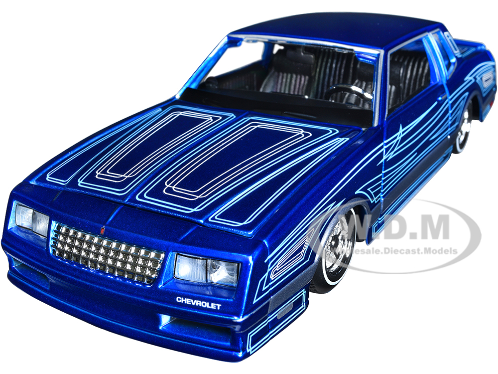 1986 Chevrolet Monte Carlo SS Lowrider Candy Blue with Graphics "Lowriders" Series 1/24 Diecast Model Car by Maisto