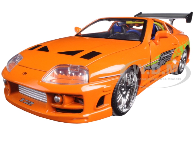 Please note the box may look different than shown..Brand new 1:24 scale diecast model car of Brians Toyota Supra Orange "Fast & Furious" Movie die cast car model by Jada.Rubber tires.Brand new box.Detailed interior exterior.Made of diecast with some plastic parts.Dimensions approximately L-8 W-3.75 H-3.25 inches.Brians Toyota Supra Orange "Fast & Furious" Movie 1/24 Diecast M
