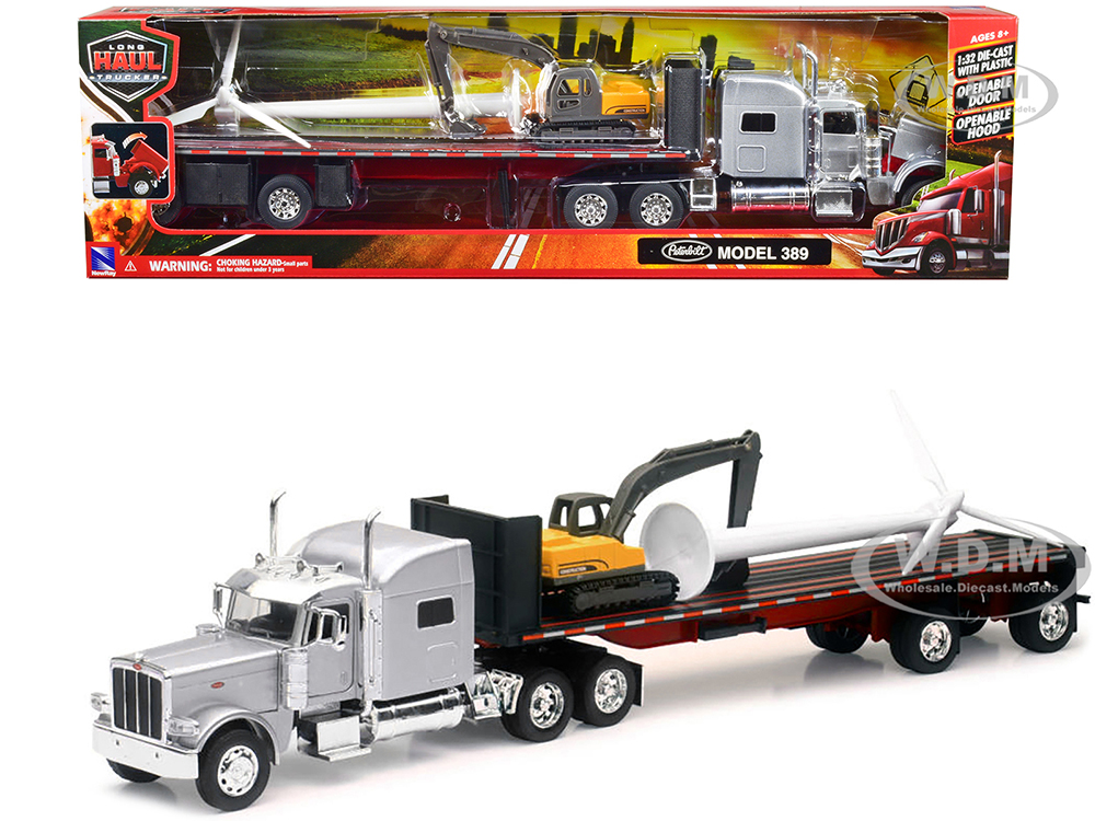Peterbilt 389 Truck with Flatbed Trailer Silver Metallic with Excavator and Wind Turbine Long Haul Truckers Series 1/32 Diecast Model by New Ray