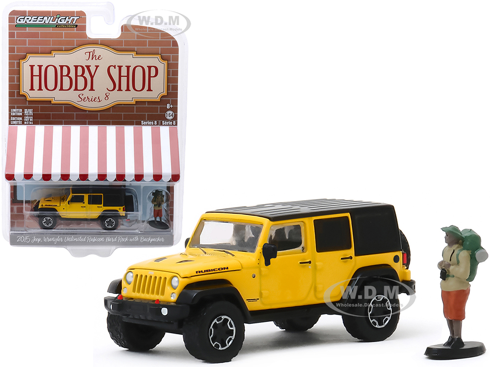 2015 Jeep Wrangler Unlimited Rubicon Hard Rock Yellow With Black Top And Backpacker Figurine "the Hobby Shop" Series 8 1/64 Diecast Model Car By Gree