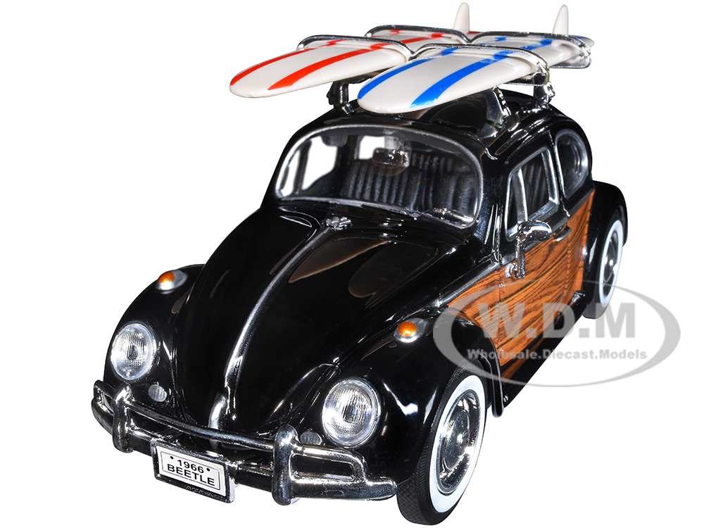 1966 Volkswagen Beetle Black with Wood Panels and Two Surfboards on Roof Rack 1/24 Diecast Model Car by Motormax