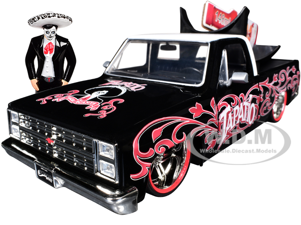 1985 Chevrolet C-10 Pickup Truck Black with White Top and Graphics with Charro Man Diecast Figure Tapatio 1/24 Diecast Model Car by Jada