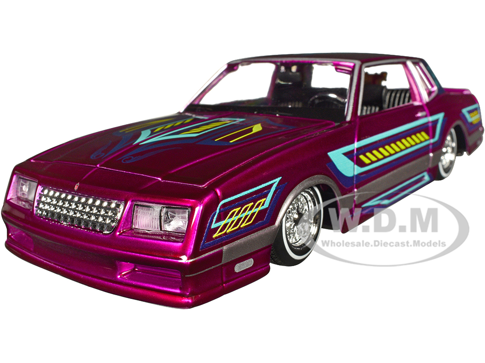1986 Chevrolet Monte Carlo SS Lowrider Pink Metallic with Graphics Lowriders Series 1/24 Diecast Model Car by Maisto