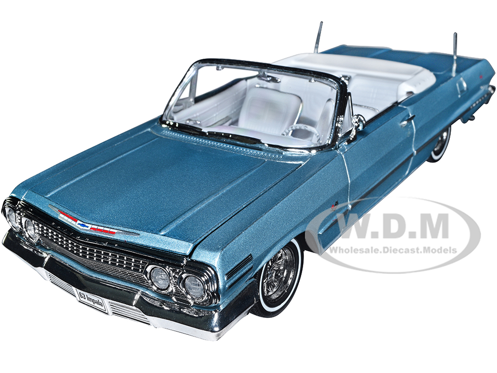 1963 Chevrolet Impala Convertible Lowrider Light Blue Metallic with White Interior Low Rider Collection 1/24 Diecast Model Car by Welly